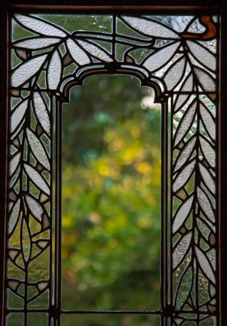 A single pane of a wisteria glass window of the Blinn House.